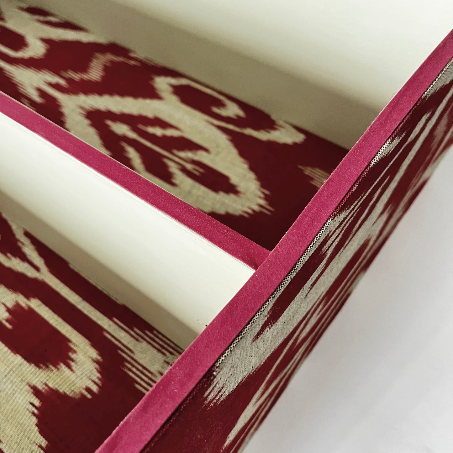 Large ikat covered bookshelf